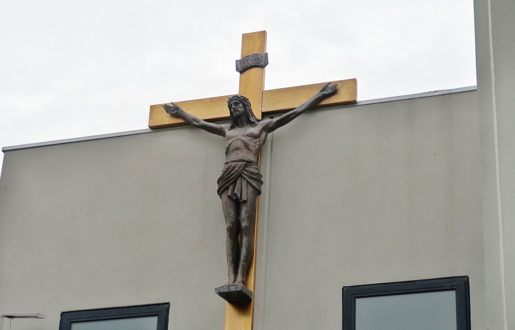 Crucifix on the exterior wall of the church